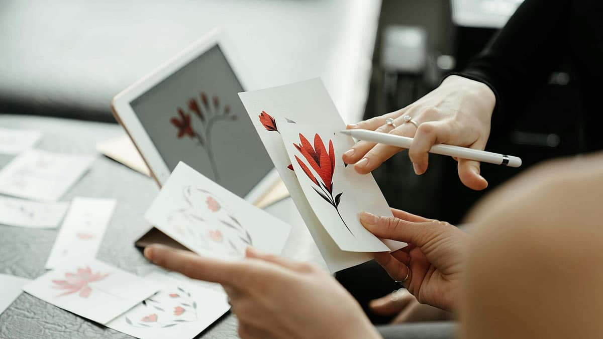 Client reviewing tattoo sketches with an artist