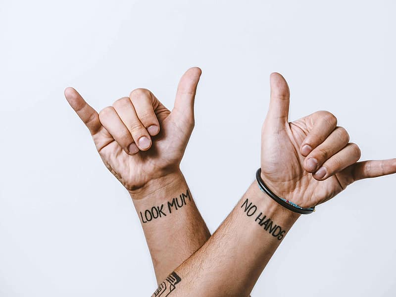 First-time client filling out consent paperwork at a tattoo studio