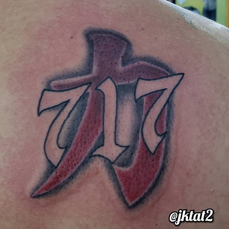 717 Angel Number with Red Calligraphic Backdrop