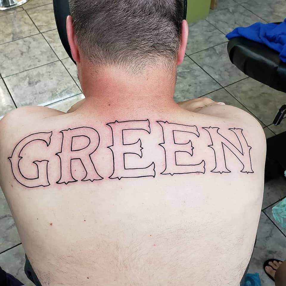 Bold 'GREEN' Upper Back Lettering