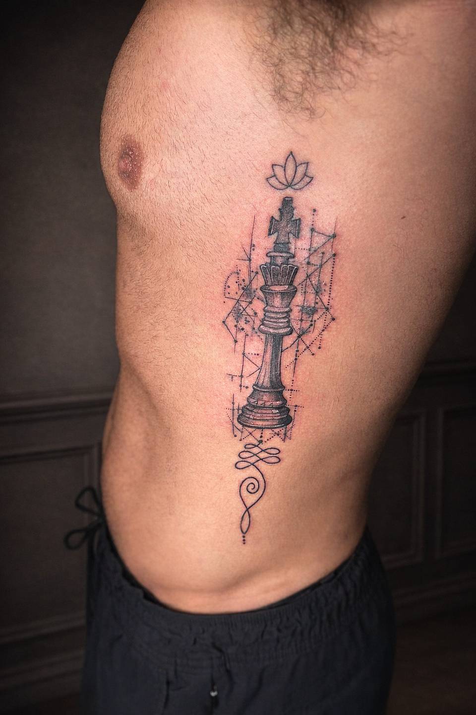 Chess King with Lotus Rib Tattoo