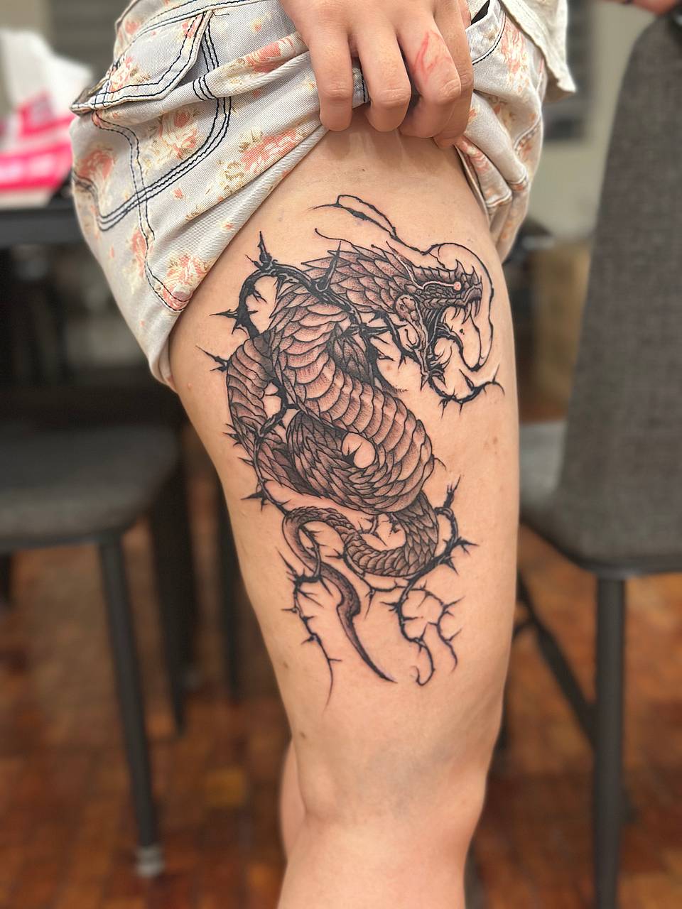 Coiled Dragon Entwined with Thorns