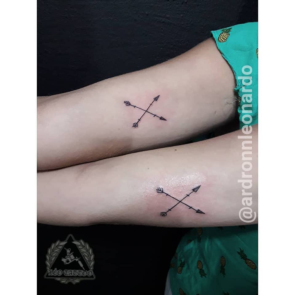 Crossed Arrows Minimal Tattoo