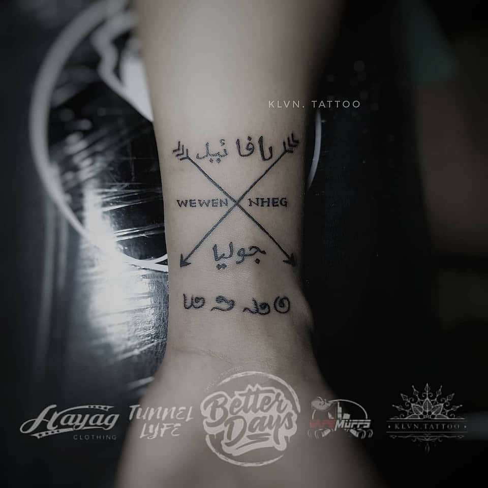 Crossed Arrows Name Tattoo