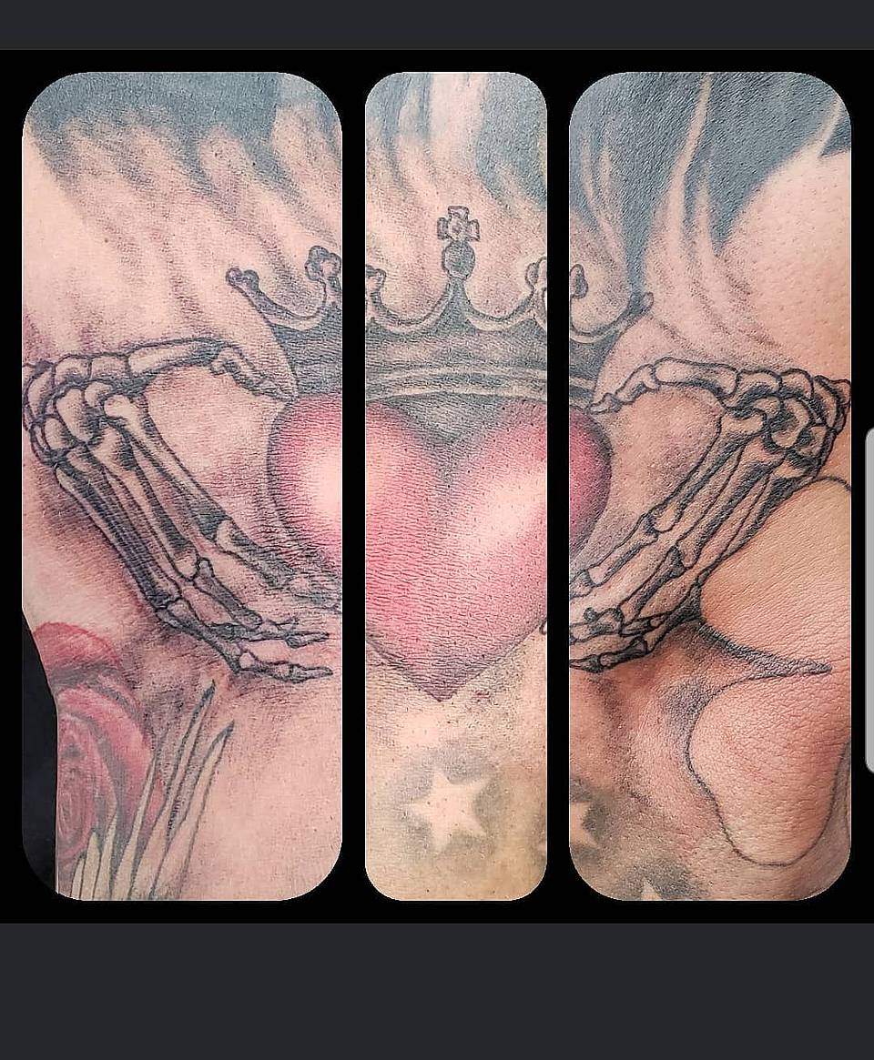 Crowned Heart in Skeletal Grasp