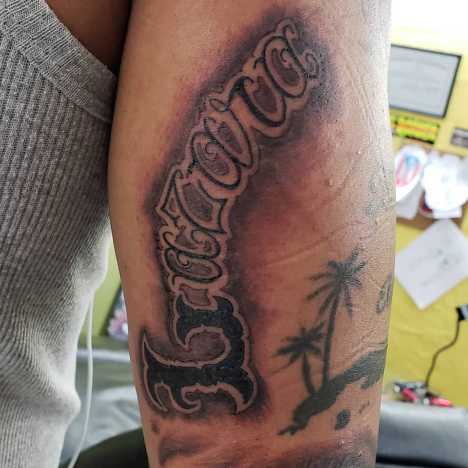 Curved Blackletter Name with Palm Silhouette