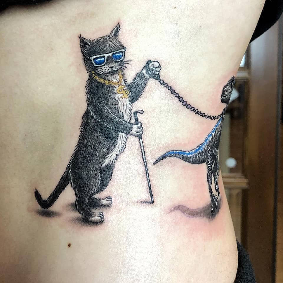 Dapper Cat and Its Leashed Dino