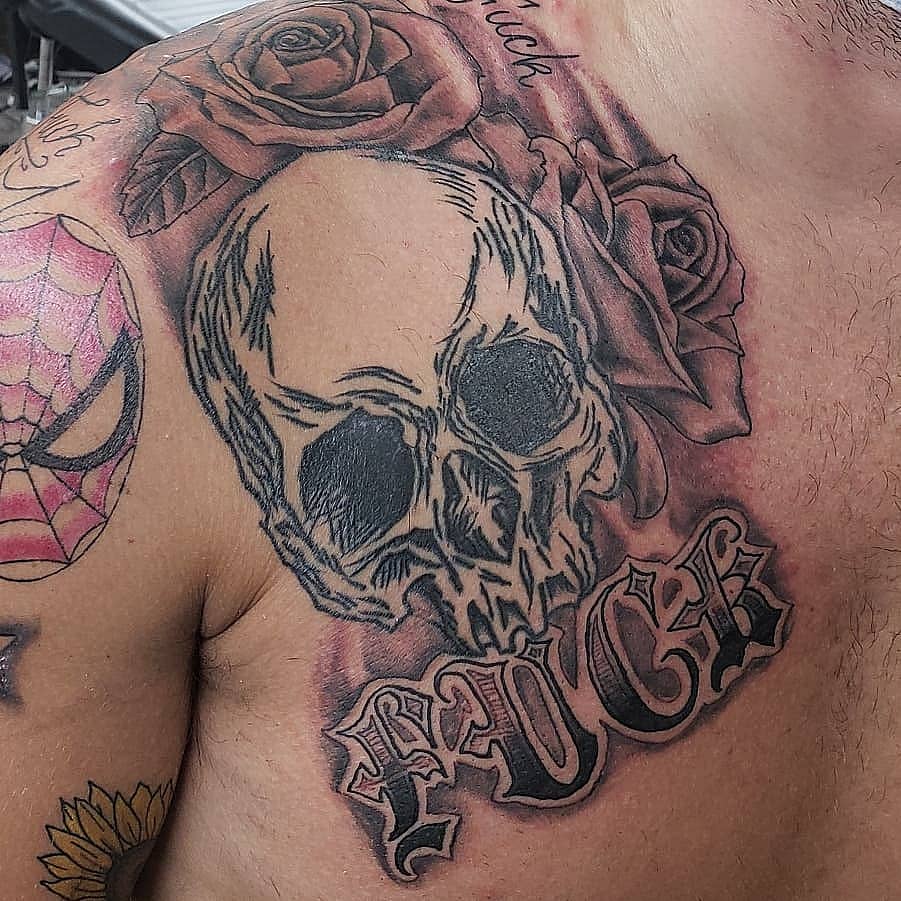Defiant Skull and Roses Chest Piece