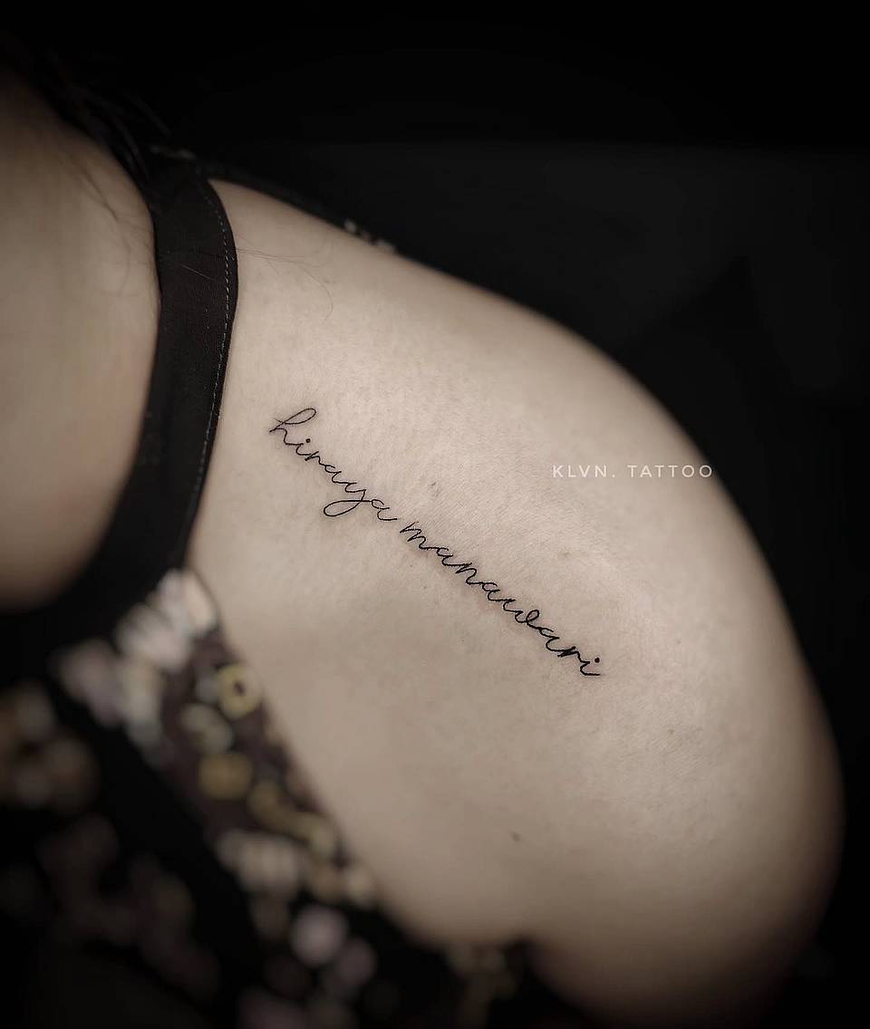 Delicate Cursive Name Tattoo
