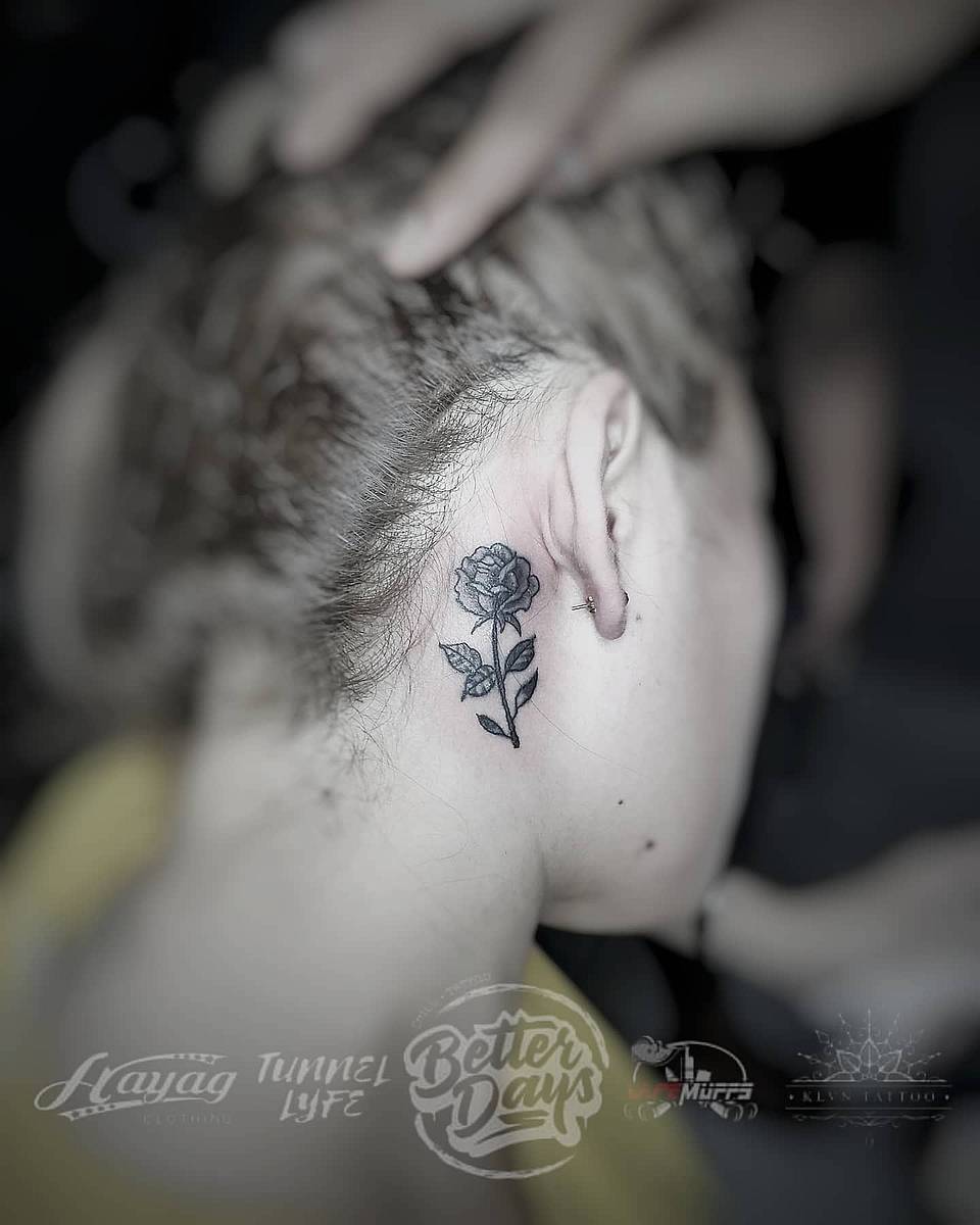 Delicate Rose Behind the Ear