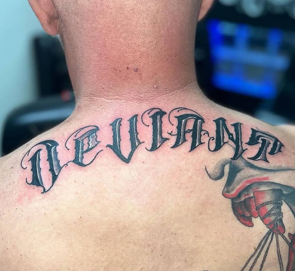 Deviant — Blackletter Across Upper Back