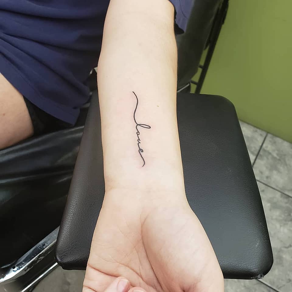 Fine-Line Lover Script Wrist Tattoo