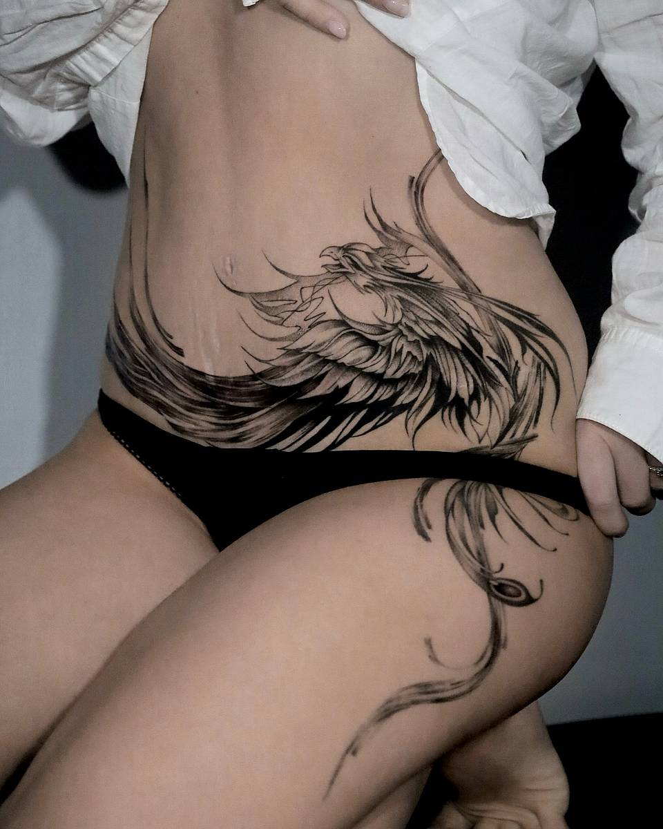 Flowing Phoenix Hip & Thigh Tattoo