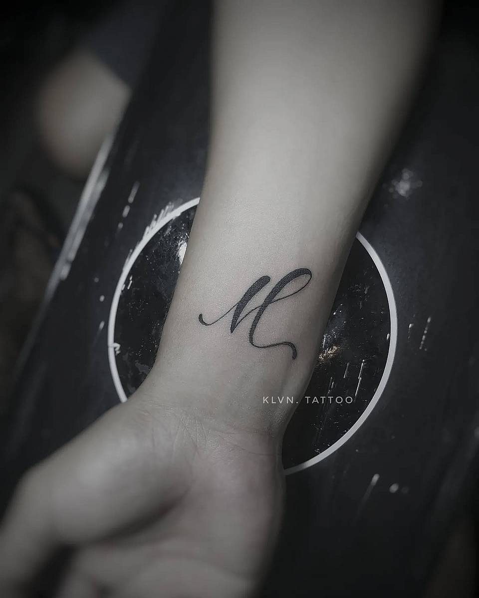 Flowing Script Initial