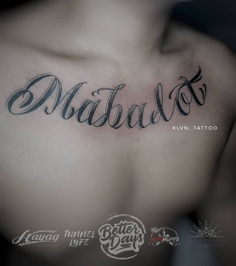 Flowing Script Name Tattoo