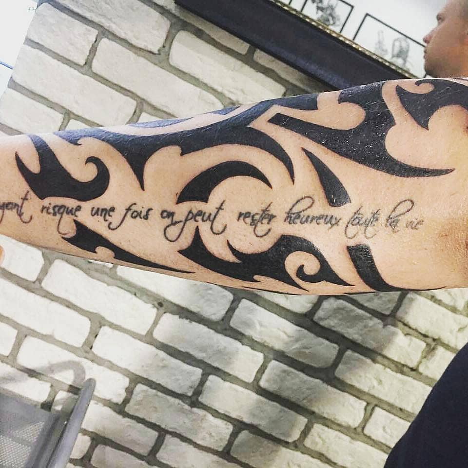 French Quote over Tribal Blackwork Forearm