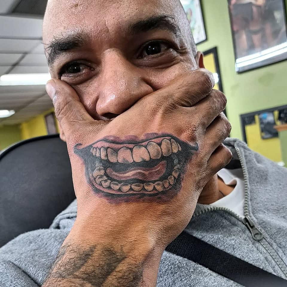 Grinning Hand Illusion