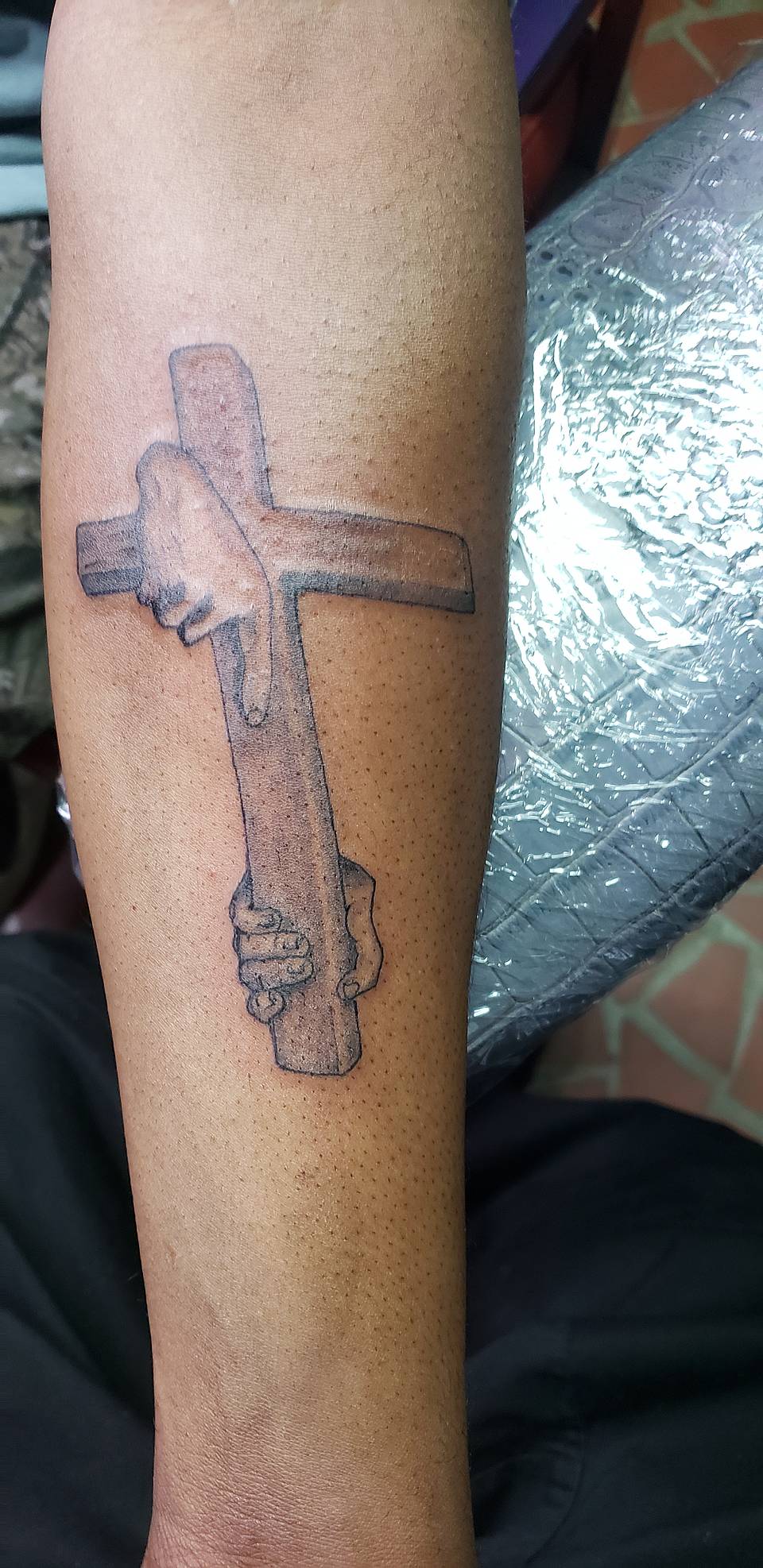 Hands Holding Cross