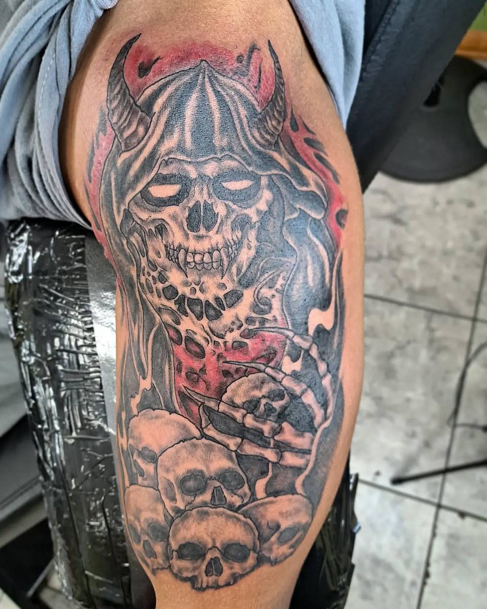 Horned Reaper Over Skulls
