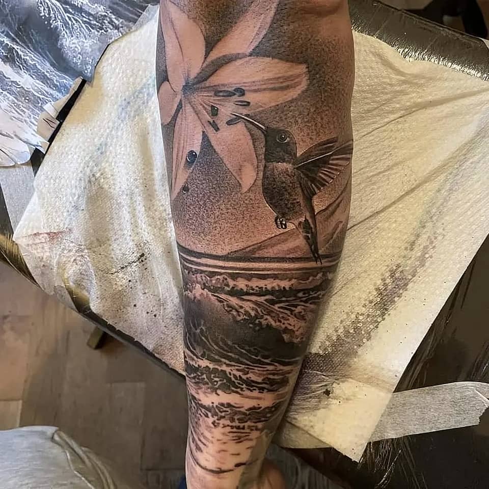 Hummingbird and Lily over Ocean Waves