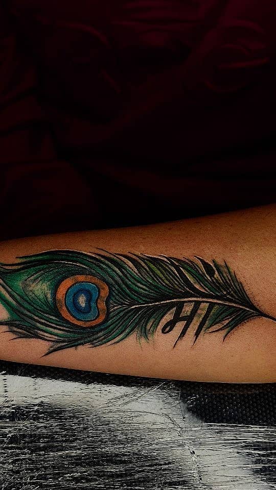 Krishna Peacock Feather with Maa Script
