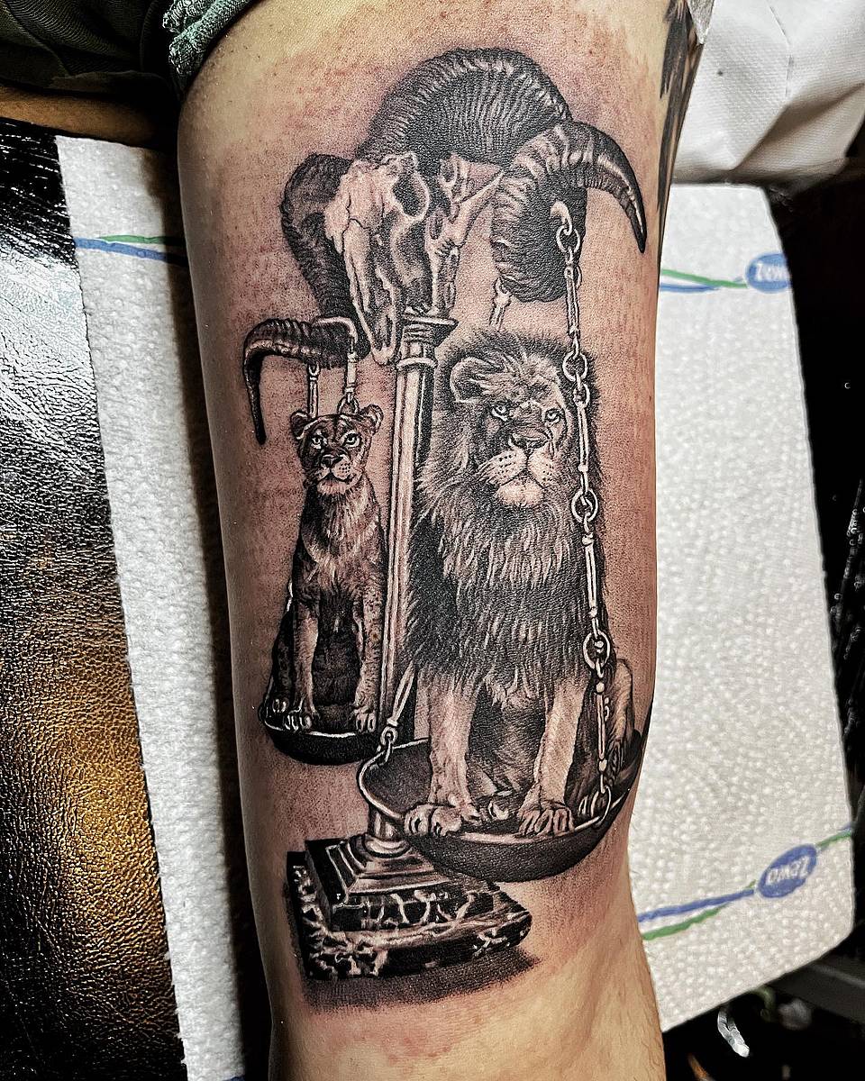 Lion and Cub on Scales with Ram Skull