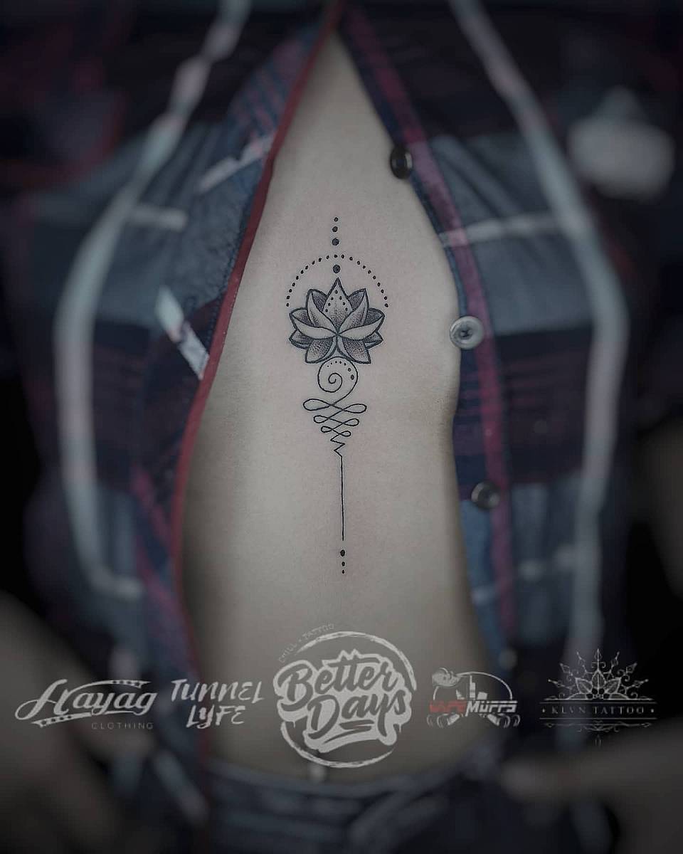 Lotus Linework Rib Tattoo