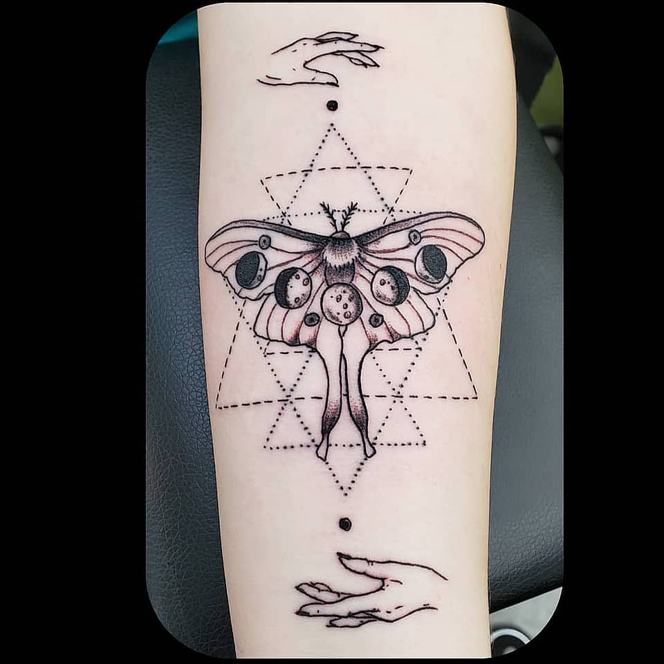 Lunar Moth Between Hands