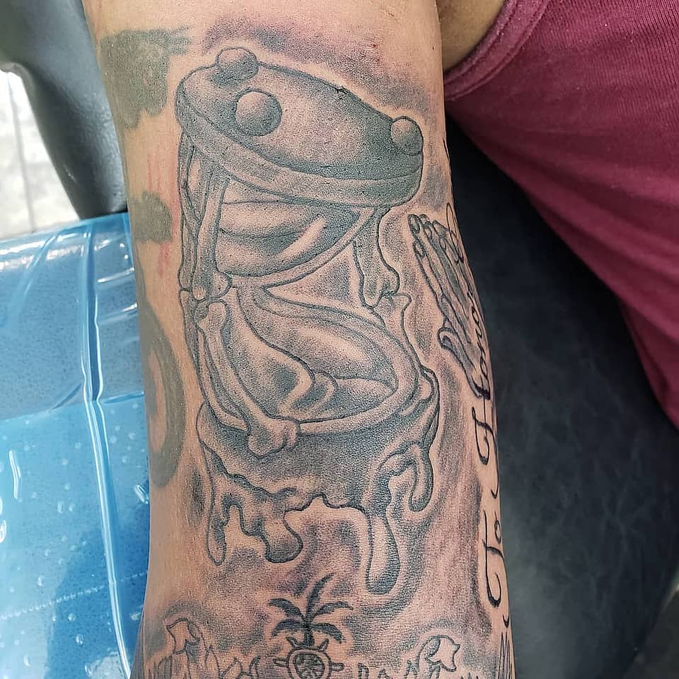 Melting Hourglass and Praying Hands