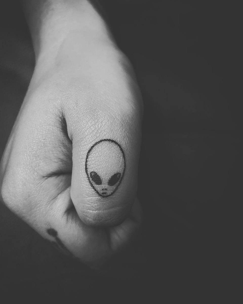 Minimal Alien Head Micro Tattoo