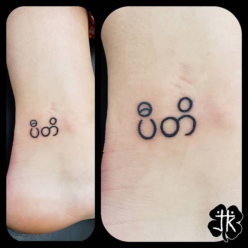 Minimal Southeast Asian Script Micro Tattoo