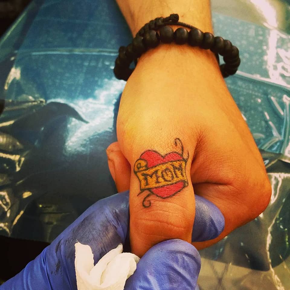 Mom Heart Banner Finger Tattoo