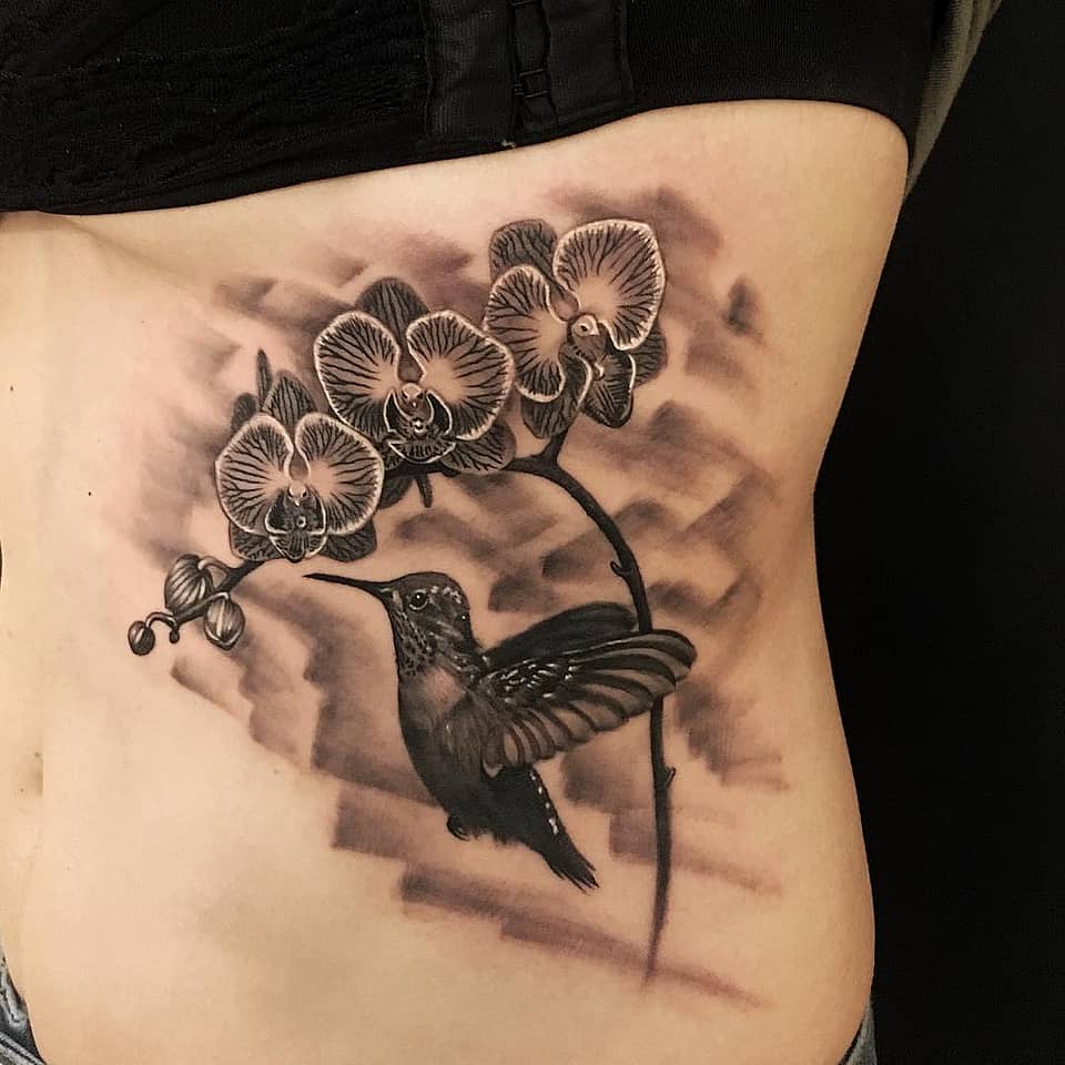 Orchid & Hummingbird Rib Tattoo