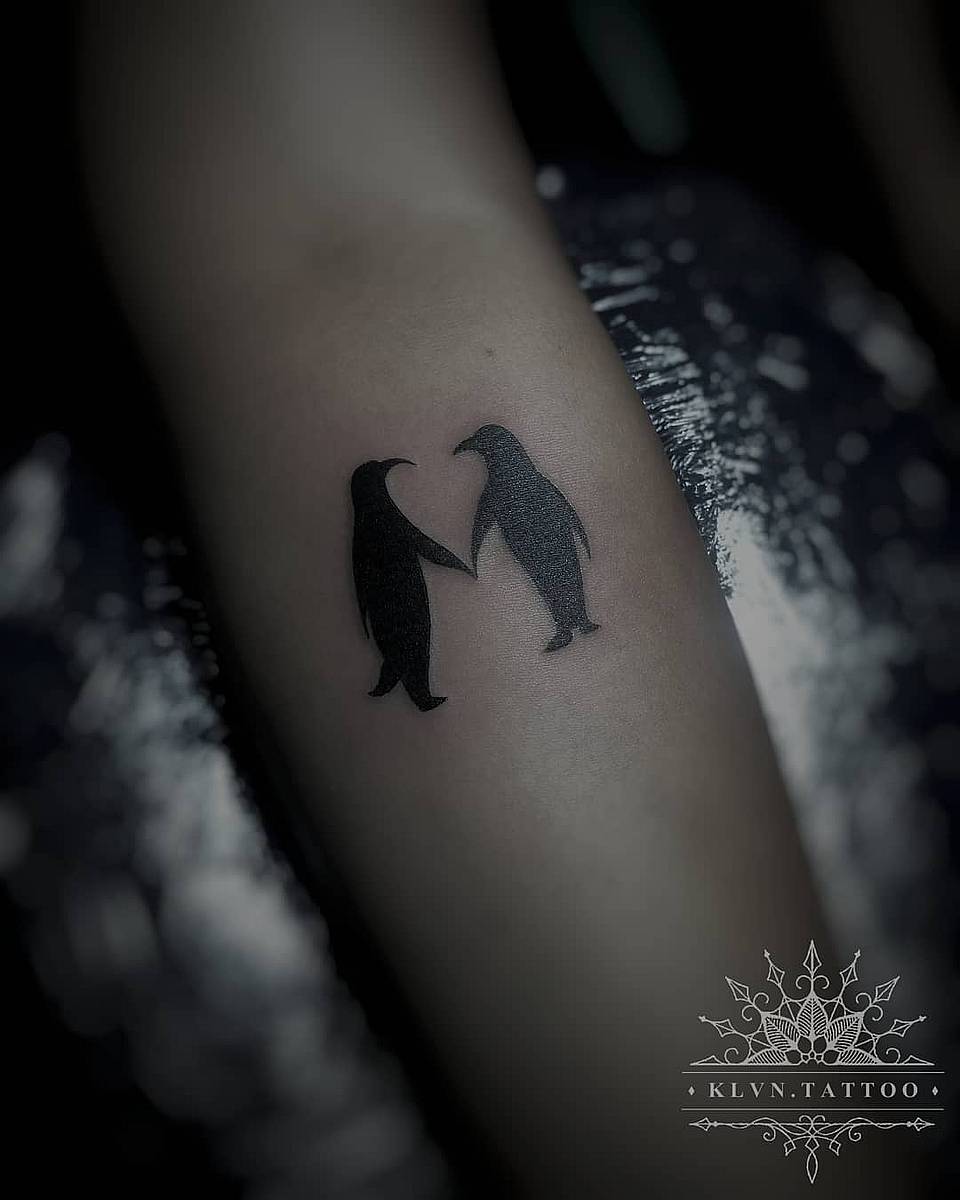 Penguin Pair Holding Flippers