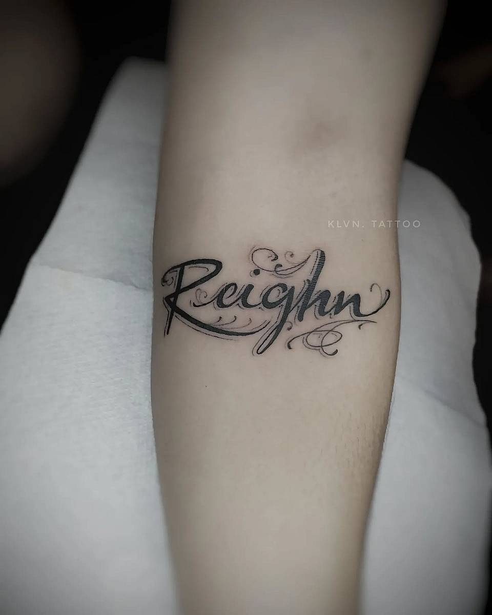 Reighn Script Name Tattoo