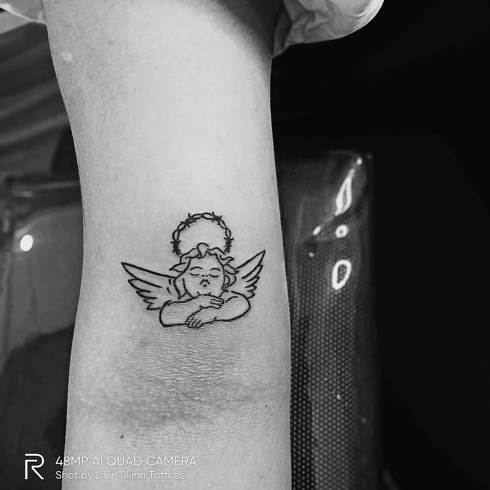 Resting Cherub with Thorned Halo