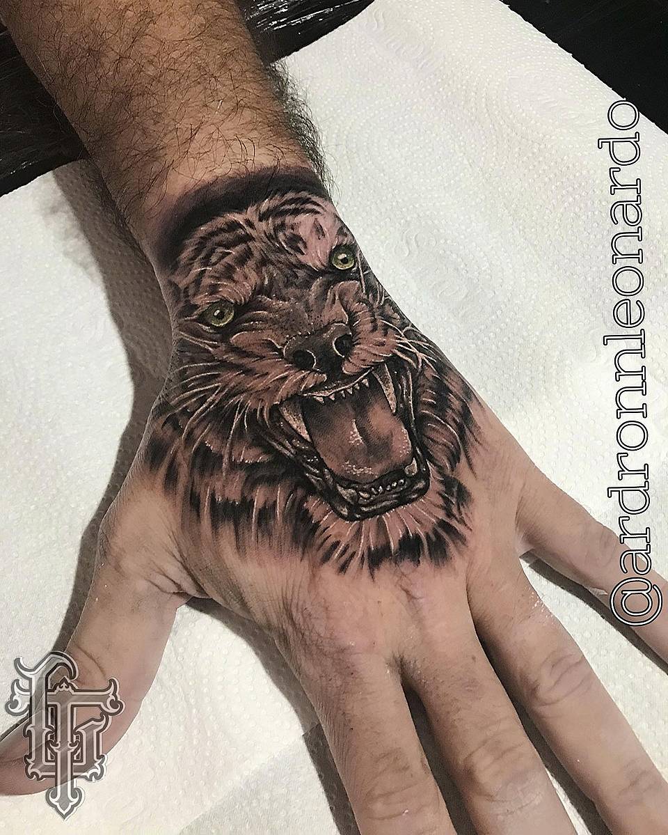 Roaring Lion Hand Tattoo