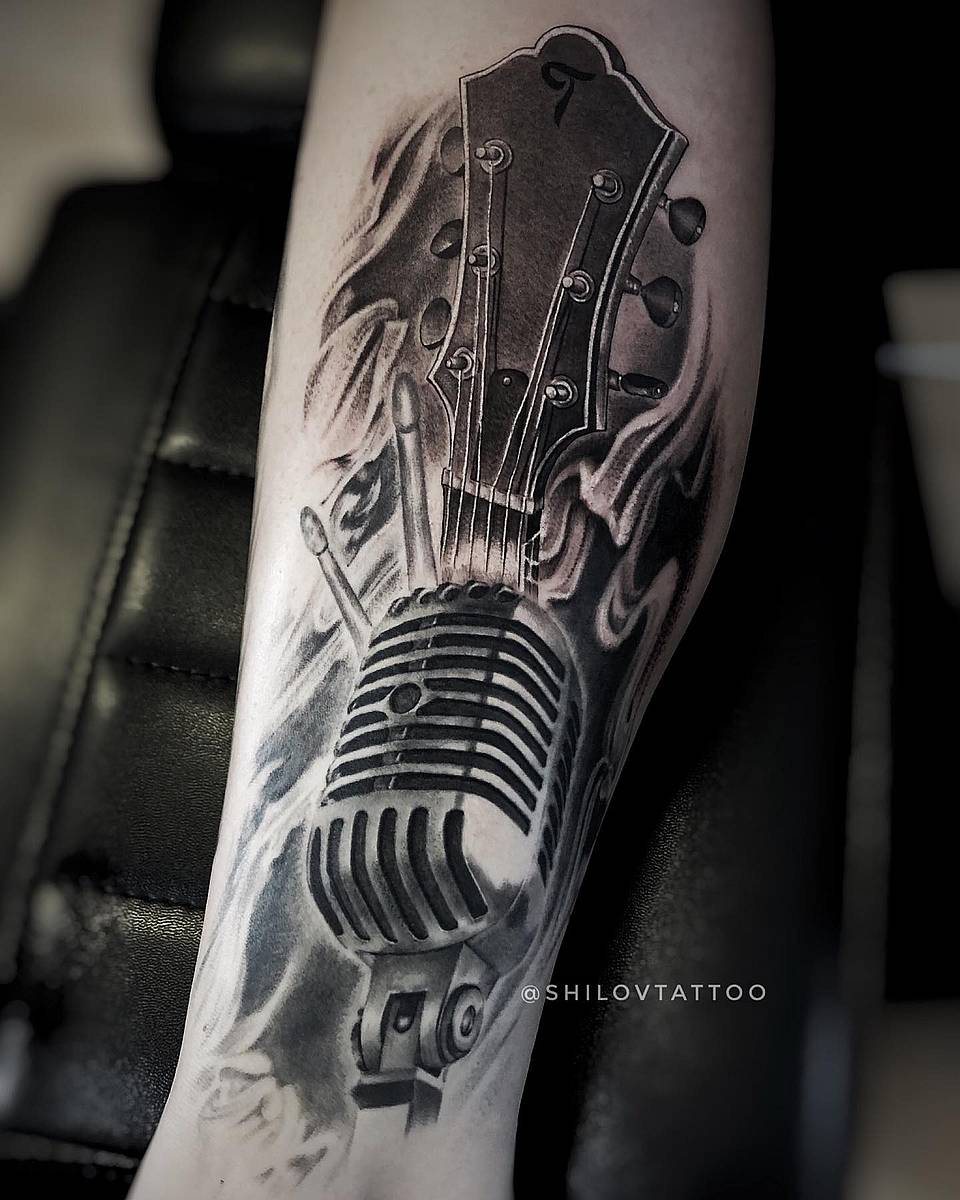 Rock Anthem: Vintage Mic, Guitar Head, and Flames