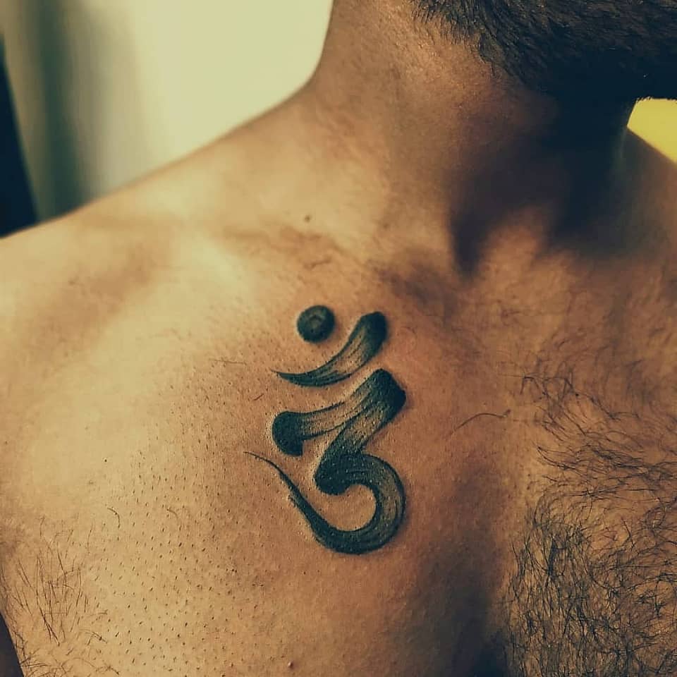 Sacred Om Brushwork on Collarbone