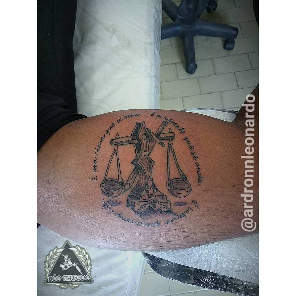 Scales of Justice with Portuguese Script