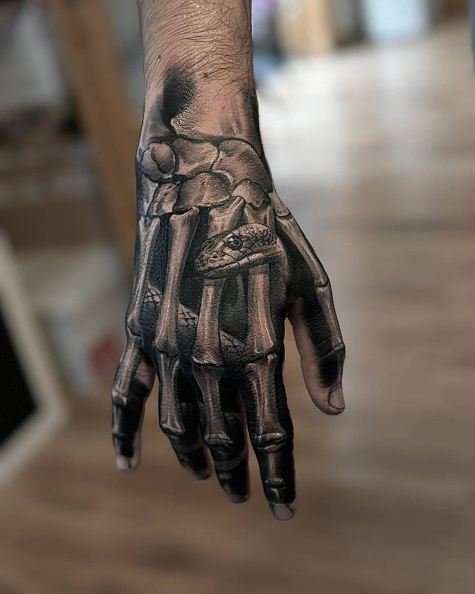 Serpent Through Skeletal Hand
