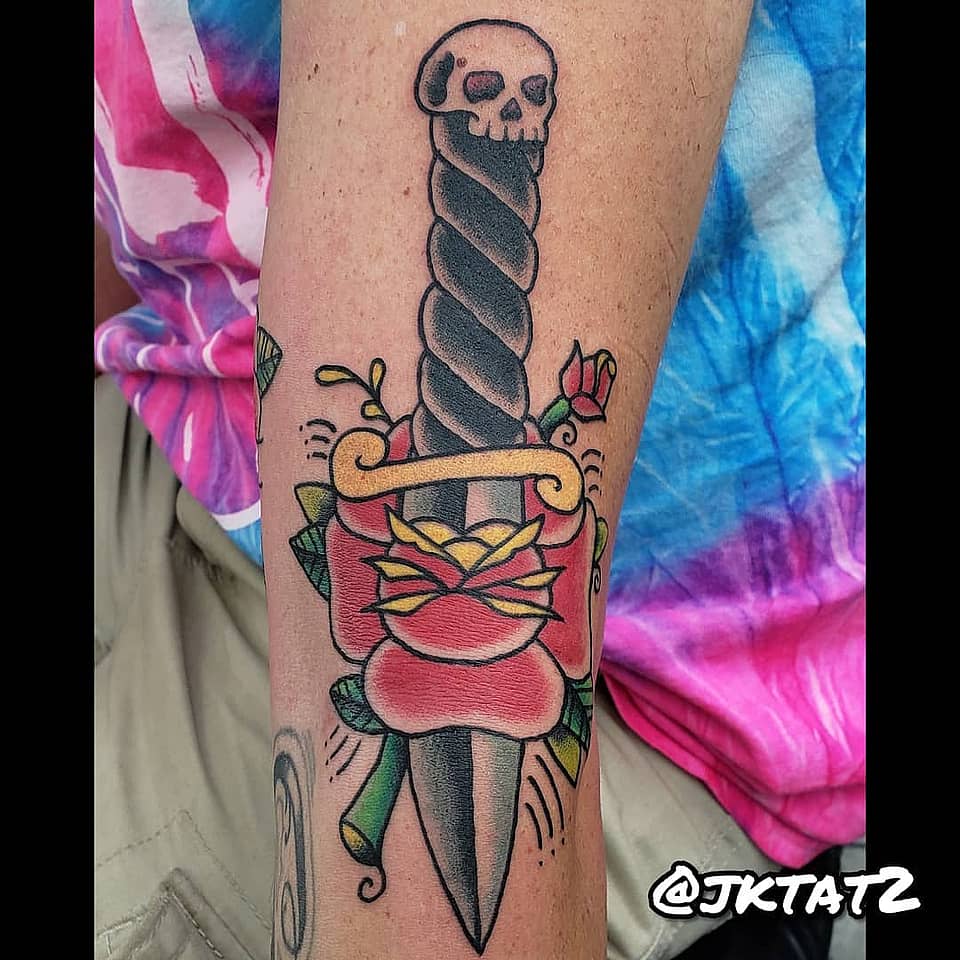 Skull-Pommel Dagger Through Rose