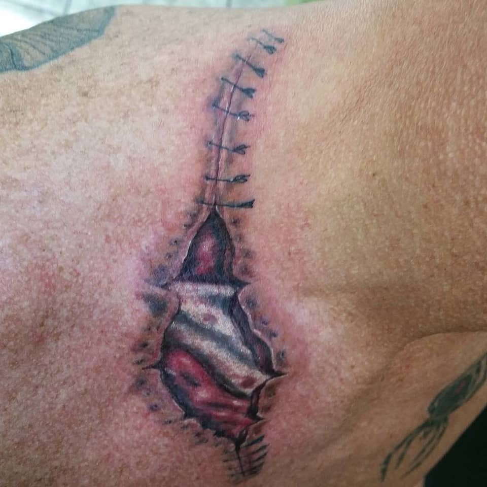 Stitched Ripped-Skin Biomech Reveal
