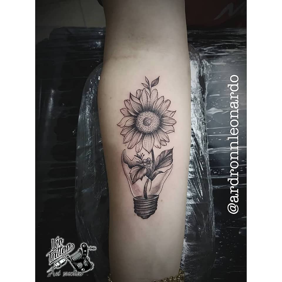 Sunflower Blooming from a Light Bulb