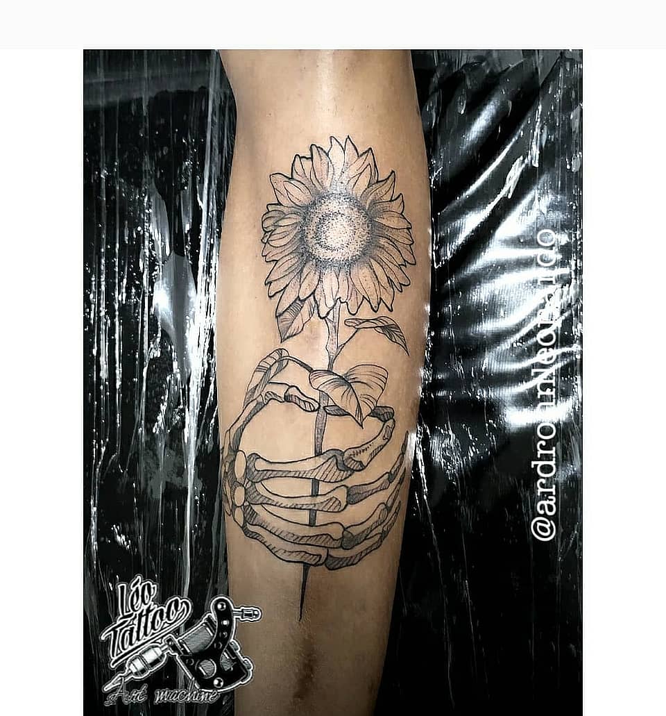 Sunflower Cradled by Skeleton Hands