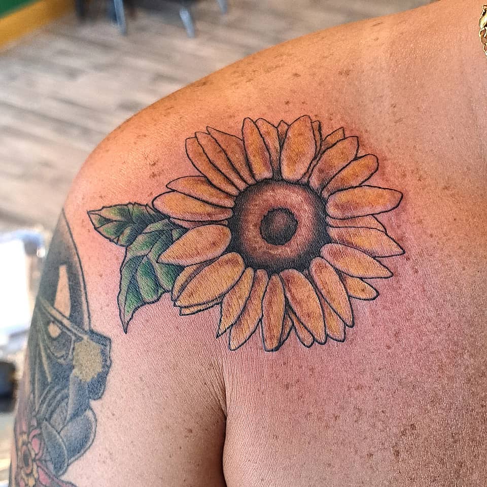 Sunlit Sunflower on Shoulder