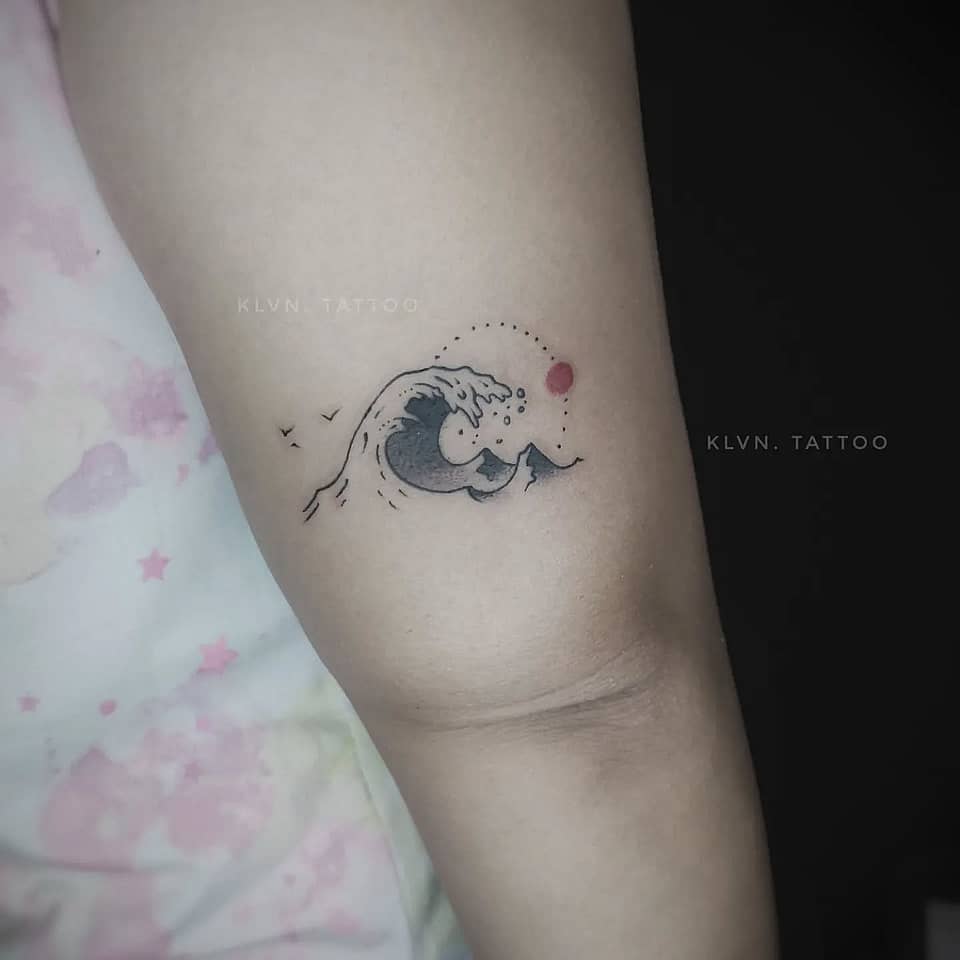 Tiny Ocean Wave with Red Sun