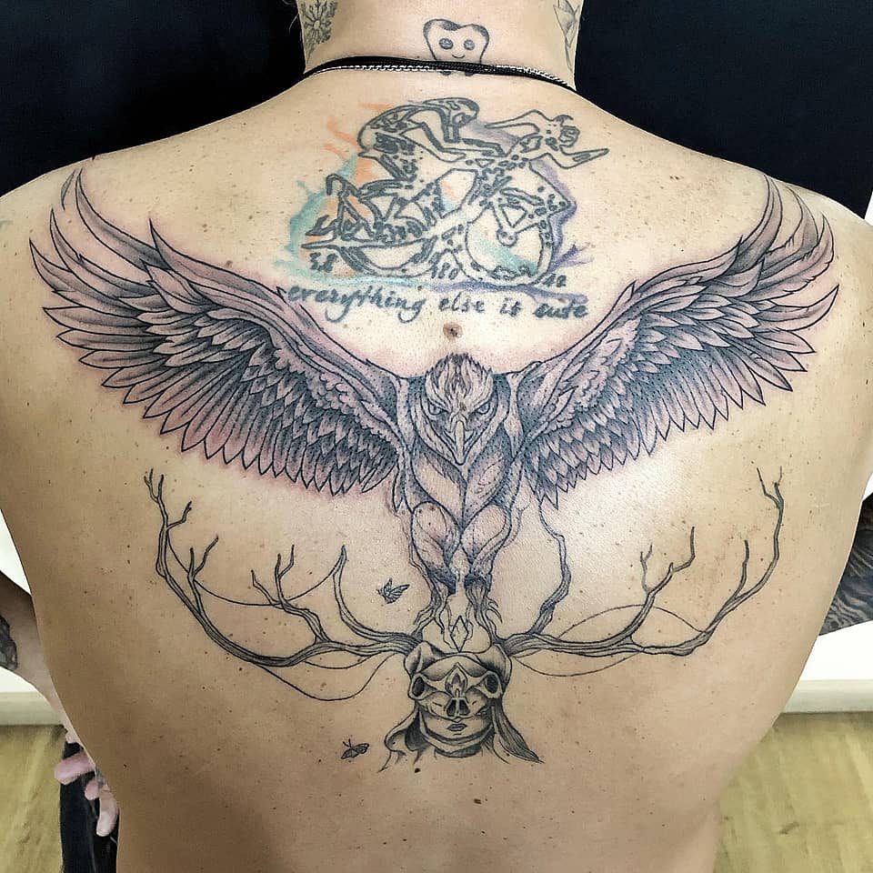 Winged Guardian Over Antlered Skull